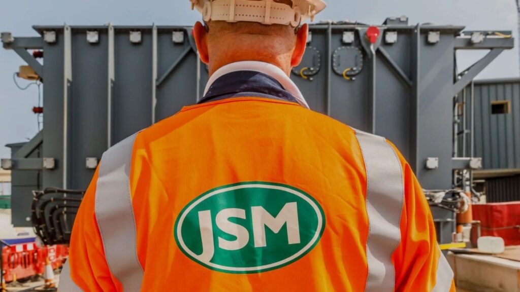 Man in JSM high vis jacket and hard hat